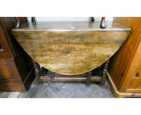 A 3'6 oak drop leaf, gate legged, dining table 