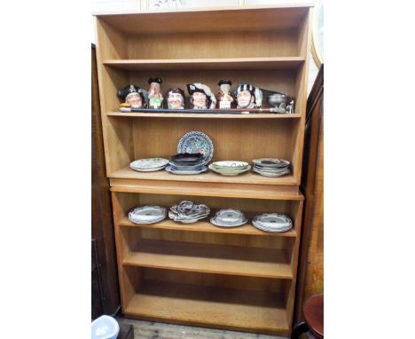 A pair of matching light oak bookcases 