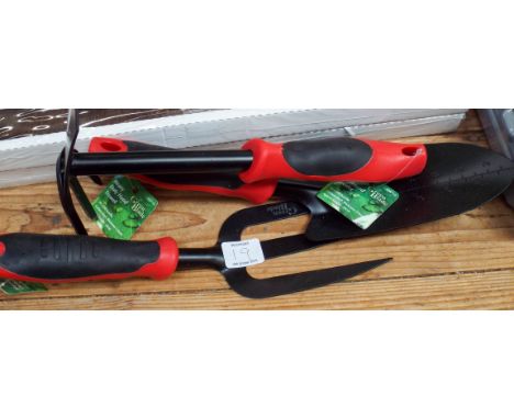 A new garden hand trowel, a new garden fork and a new garden mini hoe