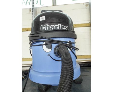 A tall Henry style blue Charles cylinder vacuum cleaner, with tools  