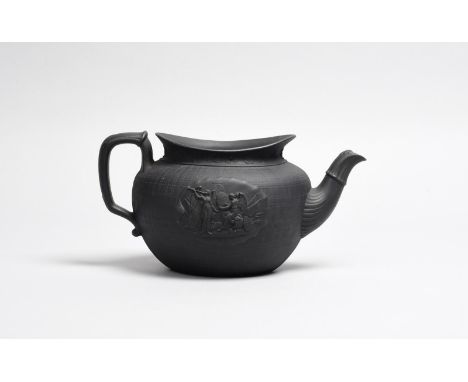 16TH JANUARY 1809: SIR JOHN MOORE IN MEMORIAM A black basalt teapot, c.1809, the navette form moulded with a scene of Sir Joh