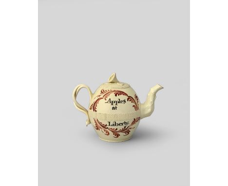 1763 CIDER ACT A creamware teapot and cover, c.1763-66, the ovoid body painted in black with the inscription 'No Cyder Act', 