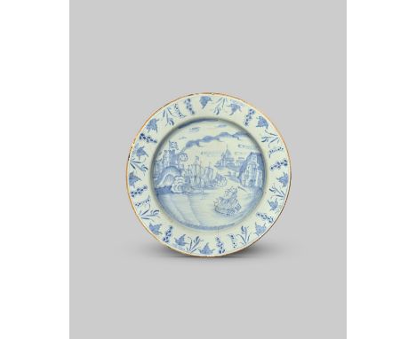 BATTLE OF PORTOBELLO A Liverpool delftware plate, c.1740, finely painted in pale blue with a scene of warships engaged in the
