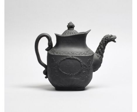 21ST JUNE 1813; WELLINGTON'S VICTORY AT VITTORIA A large black basalt teapot and cover, c.1813, the tall form moulded with a 