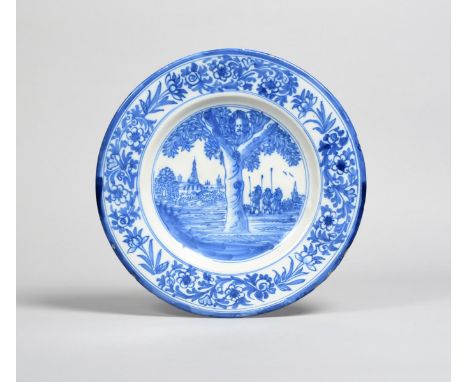 CHARLES II A Delft charger, late 19th/20th century, painted in blue with a scene depicting the Boscobel Oak with the King's h