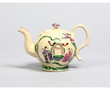 1761 CORONATION OF GEORGE III AND QUEEN CHARLOTTE A creamware teapot and cover, c.1761, moulded with the Royal couple crowned