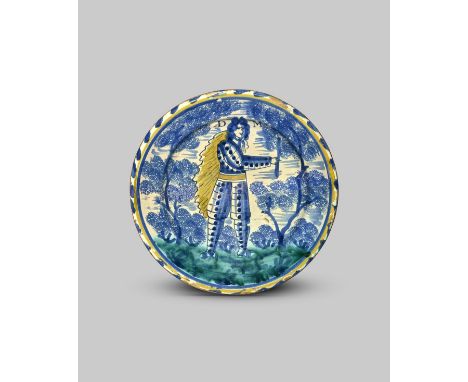 DUKE OF MARLBOROUGH A small delftware blue dash charger, c.1710, probably Bristol, painted in blue, yellow and green with a s