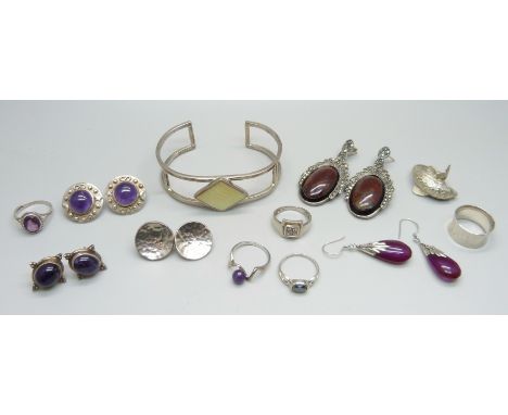 Five silver rings, some with amethyst stones, a white metal ring, five pairs of silver earrings including stone and marcasite