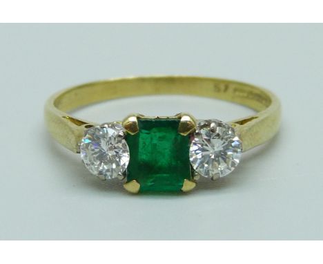 An 18ct gold, emerald and diamond trilogy ring, London 1992, 0.50ct emerald and 0.40ct diamond (2x 0.20), 2.7g, O 