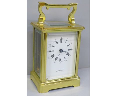 An English brass and four glass sided carriage clock 