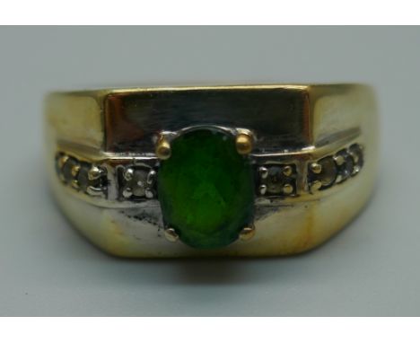 A silver gilt, green and white stone ring, T 