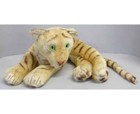 A vintage Steiff recumbent tiger 