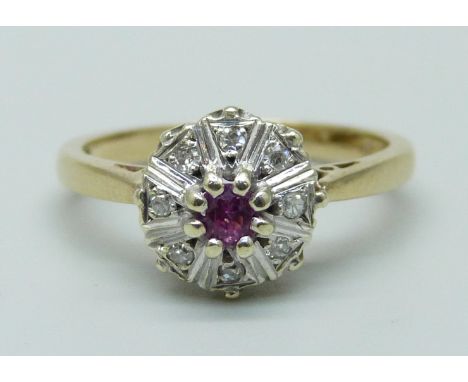 A 9ct gold, ruby and diamond cluster ring, London 1976, 3.1g, O 