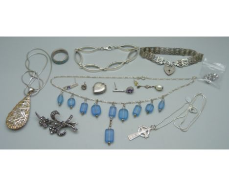 A collection of silver; bracelets, a locket, single earrings, a silver gate bracelet, etc., 87g total 