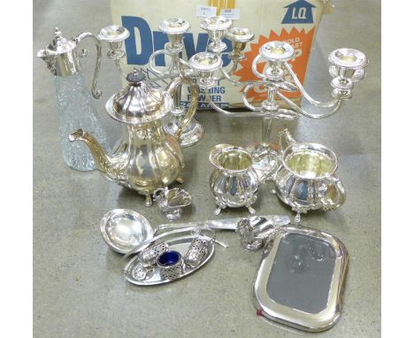 A collection of silver plate; two candelabra, claret jug, tea service and ladle, etc. 