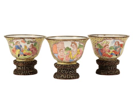 A SET OF THREE SMALL CHINESE CANTON ENAMEL EUROPEAN SUBJECT BOWLS Qianlong, painted to the exterior with panels of figures in