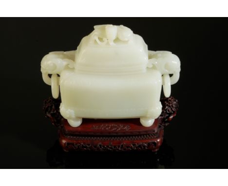 A CHINESE 'WHITE' JADE CENSER AND COVER Qing or later, with elephant head loose ring handles and a dragon finial, the base be