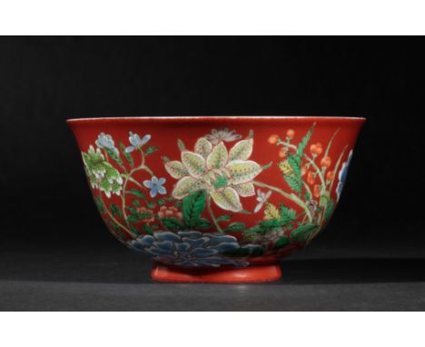 A FINE CHINESE CORAL-GROUND BOWL the exterior vividly painted with flowers in polychrome enamels on a coral ground, the inter