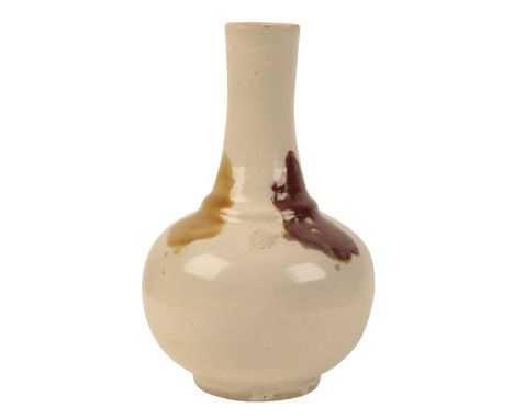 A CHINESE CREAM GLAZED POTTERY BOTTLE VASE probably Qing, decorated with three coloured splashes, impressed seal mark, 24cm