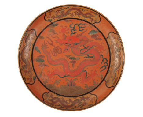 A CHINESE LACQUER DISH decorated in polychrome and incised with a central five-clawed dragon chasing a flaming pearl surround