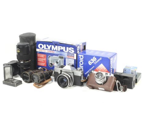 An assortment of cameras and accessories. To include a Halina X35, a Praktica LTL with a Carl Zeiss 50mm f2.8 Tessar lens, a 