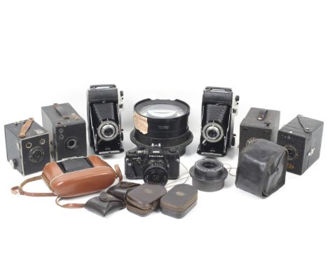 An assortment of mostly box and folding cameras. To include two Kodak Junior II's, a Kodak Brownie Junior, an Ensign All-Dist