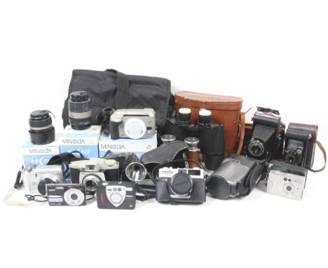 An assortment of film and digital cameras and optical equipment. To include a Vest Pocket Kodak Model B with case, a Minolta 