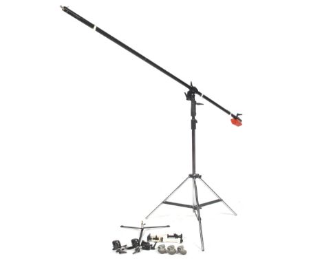 A Manfrotto 085B studio boom mounted on a Broncolor stand. The boom being 280cm long with a red counterweight, wire guides an