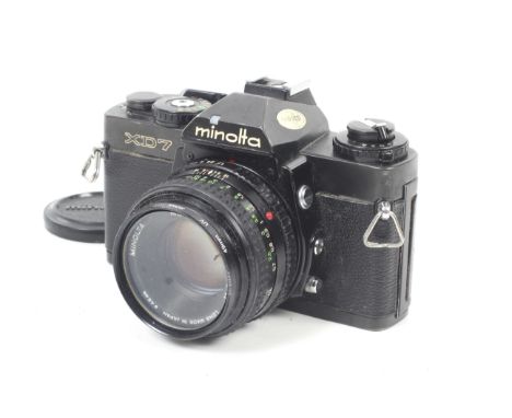 A Minolta XD7 35mm SLR camera. Black. With a Minolta 50mm f1.7 MD Rokkor lens.