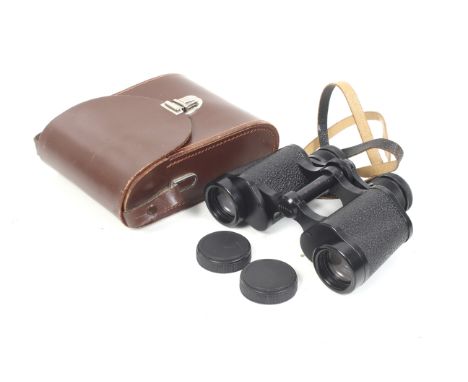 A pair of Carl Zeiss Jena Jenoptem 8x30 binoculars. Serial No. 4711776. With instruction manual, and front and rear caps. Wit