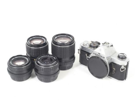 An Asahi Pentax MX 35mm SLR camera outfit. To include four SMC Pentax-M lenses; 35mm f2.8, 50mm f1.7, 100mm f2.8, and 135mm f