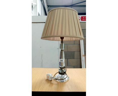 A table lamp with glass