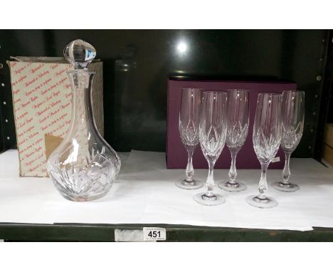 A Nachtmann decanter and 5 Nachtmann champagne flutes