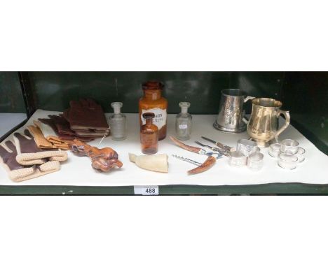 A mixed lot including vintage gloves, napkin rings, chemist bottles etc