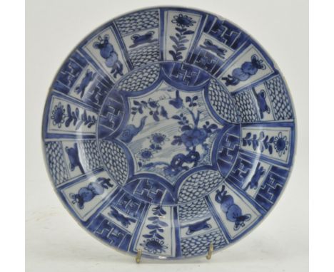 A Qing dynasty Kangxi blue and white plate. The plate decorated with sprigs of flowers and ruyi iclud in the centre, flowers,