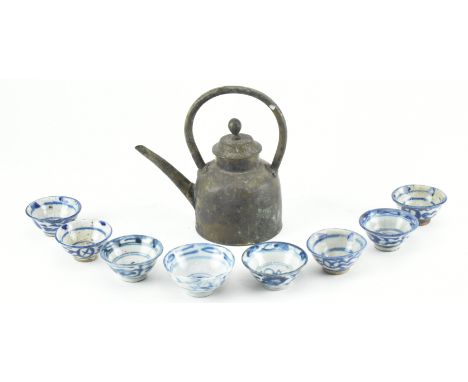 A Republic period bronze tea pot and eight pieces of 18th/19th century&nbsp;small blue and white ceramic tea cups. Tea pot me