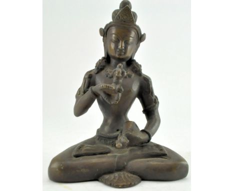 A Qing dynasty Tibetan bronze Vajrasatta buddha,&nbsp;cast seated in dhyanasana with right hand raised in karanamudra holding