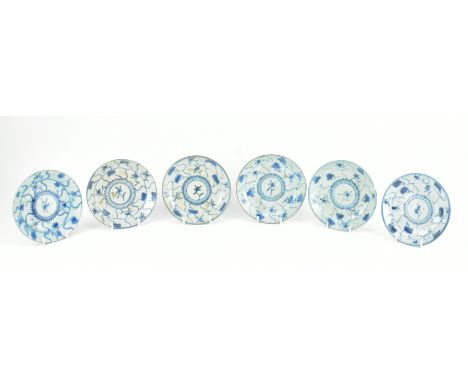 A collection of six Ming provincial saucer blue and white saucers. Each blue and white saucer decorated with flowers, double 