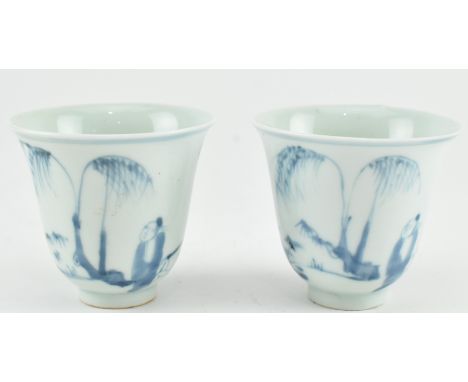 A pair of blue and white ceramic tea cup. The flared rim tea cup depicting a scene of a scholar wearing Ming dynasty clothes 
