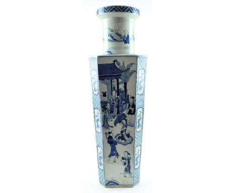 A Qing dynasty blue and white ceramic vase. The vase with a flared neck and octagonal tapering body, the neck decorated with 