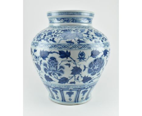 A large Qing dynasty blue and white ceramic jar. The baluster body with upright rim. The mouth rim with floral scrolls and wa