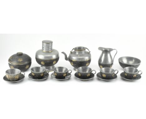 A Chinese Oriental early 20th century pewter &amp; coconut shell tea service. The service comprising of tea pot, milk jug, li