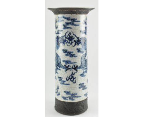 A large Qing dynasty flared rim crackle glazed blue and white Nanking arrow holder.&nbsp; The holder depicts a scene of two 4