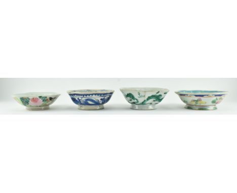 A group of four Qing dynasty to republic period ceramic bowls. The lot comprising a Ming style blue and white "floral" bowl, 