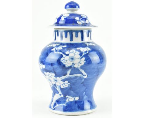 A Qing dynasty blue and white prunus ginger jar with lid. The baluster shaped vase decorated with&nbsp;blossoming prunus, bea