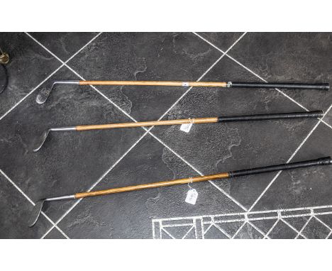 Three Vintage Golf Clubs with hickory shafts and 'Staynorus' rustless alloy heads