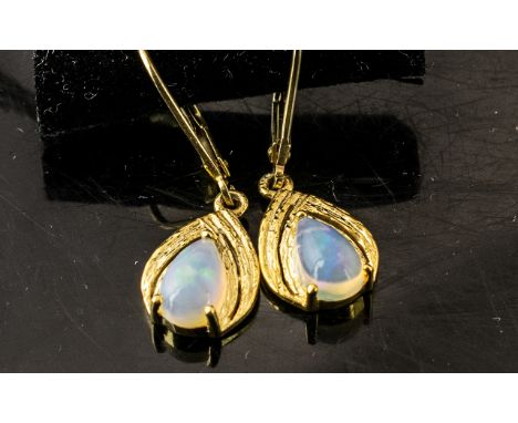 Pair of Opal Drop Earrings, pear cut solitaire opal cabochons, each over .5ct, held in decorative, pear drop, 14ct gold verme