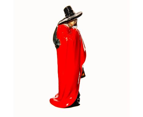This original Guy Fawkes figurine has a very shiny gloss finish. He is wearing a stunning red cap, with a black robe on the i
