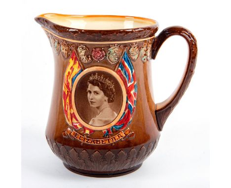 Photographic portrait of the Queen with the Union Jack and Royal Standard. Reverse has Windsor Castle.Royal Doulton backstamp