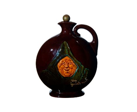 Dark brown glaze with Dewar's removable stopper and relief portrait of robed monk.Royal Doulton and Dewar's backstamp. Age re